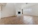 Bright living room features tile flooring, a fireplace, and many windows with plantation shutters at 7800 E Lincoln Dr # 2092, Scottsdale, AZ 85250