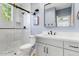 Modern bathroom with a glass-enclosed shower, white vanity, and stylish fixtures at 9087 E Mountain Spring Rd, Scottsdale, AZ 85255