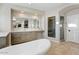 Elegant bathroom featuring dual sinks, a large mirror, and a walk-in shower at 9087 E Mountain Spring Rd, Scottsdale, AZ 85255