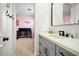 Bright bathroom with a gray vanity, white countertop, and modern black fixtures at 9087 E Mountain Spring Rd, Scottsdale, AZ 85255