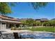 Community area showcasing a splash pad, seating, and desert landscaping with mountain views at 9087 E Mountain Spring Rd, Scottsdale, AZ 85255