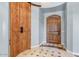 Hallway showcasing stylish wooden doors, decorative flooring, and architectural details at 9087 E Mountain Spring Rd, Scottsdale, AZ 85255