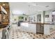 Open concept kitchen with stainless appliances, large island, and seamless flow to the living area at 9087 E Mountain Spring Rd, Scottsdale, AZ 85255