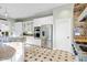 Bright kitchen with stainless steel appliances, granite counters, and travertine tile flooring at 9087 E Mountain Spring Rd, Scottsdale, AZ 85255