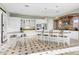 Eat-in kitchen with white cabinets, granite countertops, stainless appliances, and breakfast bar at 9087 E Mountain Spring Rd, Scottsdale, AZ 85255