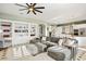 Inviting living room with large sofa, built-in bookshelves, and open layout at 9087 E Mountain Spring Rd, Scottsdale, AZ 85255