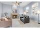 Elegant living room featuring a fireplace, plantation shutters, and neutral color palette at 9087 E Mountain Spring Rd, Scottsdale, AZ 85255