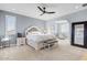 Spacious main bedroom featuring a king bed, walk-in closet, and sitting area at 9087 E Mountain Spring Rd, Scottsdale, AZ 85255