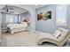 Airy main bedroom featuring an arched entry to a sitting area and ample natural light at 9087 E Mountain Spring Rd, Scottsdale, AZ 85255