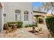 Charming outdoor patio with stone tile, seating area, fountain and beautiful landscaping at 9087 E Mountain Spring Rd, Scottsdale, AZ 85255