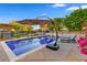 Relaxing pool area with lounge chairs, umbrellas and BBQ area, perfect for outdoor entertaining at 9087 E Mountain Spring Rd, Scottsdale, AZ 85255