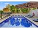 Beautiful pool area with serene landscaping and comfortable lounge chairs at 9087 E Mountain Spring Rd, Scottsdale, AZ 85255