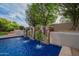 Elegant pool with stacked stone water feature and clear blue water at 9087 E Mountain Spring Rd, Scottsdale, AZ 85255