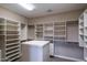 Organized walk-in closet with shelving, drawers, and ample storage space at 9087 E Mountain Spring Rd, Scottsdale, AZ 85255