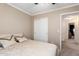Bedroom with carpet floors, neutral walls, closet and hallway access at 9662 W Sunnyslope Ln, Peoria, AZ 85345