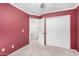 Bedroom with carpet floors, neutral walls, closet and access to hallway at 9662 W Sunnyslope Ln, Peoria, AZ 85345