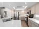 Bright kitchen with stainless steel appliances, countertop space and tile flooring at 9662 W Sunnyslope Ln, Peoria, AZ 85345