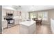 Bright kitchen with white cabinetry, stainless steel appliances, and tile flooring at 9662 W Sunnyslope Ln, Peoria, AZ 85345