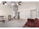 Living room featuring stairs to the second floor, tile flooring, and neutral paint at 9662 W Sunnyslope Ln, Peoria, AZ 85345