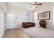 Living room with vaulted ceiling, ceiling fan, carpet, and front door entry at 9662 W Sunnyslope Ln, Peoria, AZ 85345