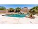 Inviting pool area with lush landscaping, decorative rocks, and a peaceful ambiance at 9662 W Sunnyslope Ln, Peoria, AZ 85345