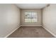 Carpeted bedroom featuring a window offering natural light at 1016 W Juanita Ave, Gilbert, AZ 85233