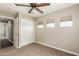 Bright bedroom with neutral tones and multiple windows providing ample natural light at 1016 W Juanita Ave, Gilbert, AZ 85233