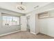 Comfortable bedroom boasts neutral tones, large window, and walk-in closet at 1016 W Juanita Ave, Gilbert, AZ 85233