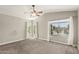 Bright bedroom with natural light streaming through large windows and neutral-toned walls at 1016 W Juanita Ave, Gilbert, AZ 85233