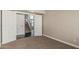 Cozy bedroom with neutral carpet and a view of the house staircase at 1016 W Juanita Ave, Gilbert, AZ 85233