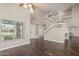Home foyer showcasing staircase, hardwood floors, and natural light at 1016 W Juanita Ave, Gilbert, AZ 85233
