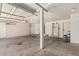 Spacious two-car garage featuring ample storage and painted walls at 1016 W Juanita Ave, Gilbert, AZ 85233