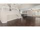 Open-concept living room featuring a staircase, hardwood floors, and modern kitchen at 1016 W Juanita Ave, Gilbert, AZ 85233