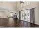Open-concept living room showcasing hardwood floors, and outdoor patio access at 1016 W Juanita Ave, Gilbert, AZ 85233