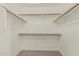 Spacious walk-in closet with multiple shelves and rods for ample storage at 1016 W Juanita Ave, Gilbert, AZ 85233