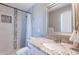 Clean bathroom featuring a granite countertop, updated fixtures, and a tiled shower with a rain shower head at 1217 N 78Th St, Scottsdale, AZ 85257