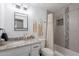 Modern bathroom with updated vanity, sleek mirror, tiled shower, and stylish decor at 1217 N 78Th St, Scottsdale, AZ 85257