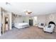 Spacious bedroom with neutral paint features great natural light and a ceiling fan at 1217 N 78Th St, Scottsdale, AZ 85257