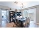 Elegant dining room featuring a modern table, stylish chairs, and sliding glass doors for natural light and easy access at 1217 N 78Th St, Scottsdale, AZ 85257