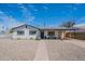 Charming single-story home featuring a low-maintenance desert landscape and inviting curb appeal under a bright, sunny sky at 1217 N 78Th St, Scottsdale, AZ 85257