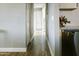 Bright hallway showcasing hardwood floors, leading to bedrooms and other areas of the home at 1217 N 78Th St, Scottsdale, AZ 85257