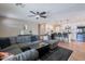 Spacious living area with a large sectional, open to a modern kitchen with bar seating and stainless steel appliances at 1217 N 78Th St, Scottsdale, AZ 85257