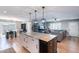 Bright open concept living space featuring modern kitchen island, dining area, and comfortable living room at 1217 N 78Th St, Scottsdale, AZ 85257