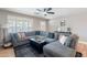 Comfortable living room with a large sectional sofa, stylish decor, and natural light through plantation shutters at 1217 N 78Th St, Scottsdale, AZ 85257