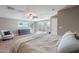 Spacious bedroom featuring carpet floors, neutral walls, ceiling fan and direct access to backyard patio at 1217 N 78Th St, Scottsdale, AZ 85257