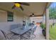 Relaxing covered back patio featuring ceiling fans and an outdoor dining setup at 12841 W W . Via Camille --, El Mirage, AZ 85335