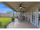 Spacious covered back patio with multiple ceiling fans and outdoor seating area at 12841 W W . Via Camille --, El Mirage, AZ 85335