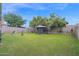 Expansive backyard with lush green grass and mature trees, and aviary at 12841 W W . Via Camille --, El Mirage, AZ 85335
