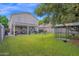 The backyard features a covered patio, a grassy lawn, and a birdcage at 12841 W W . Via Camille --, El Mirage, AZ 85335