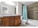 Bathroom featuring granite countertops, a soaking tub, and tiled shower with decorative accents at 12841 W W . Via Camille --, El Mirage, AZ 85335